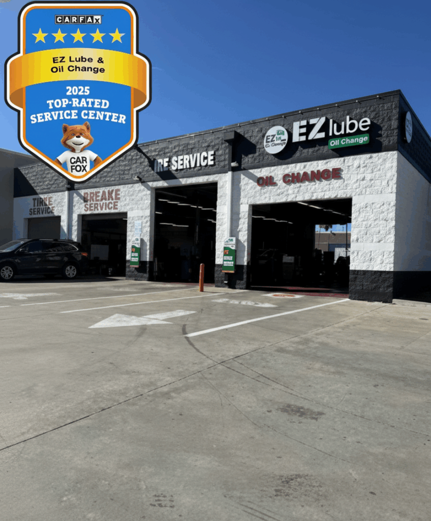 Exterior of EZ Lube & Oil Change building in Palmdale featuring the 2025 CARFAX Top-Rated Service Center award badge.