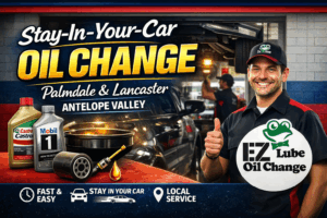 Stay-in-your-car drive-thru oil change at EZ Lube Oil Change in Palmdale and Lancaster, featuring a technician, oil filter, Castrol and Mobil 1 motor oil, and fast local service in the Antelope Valley