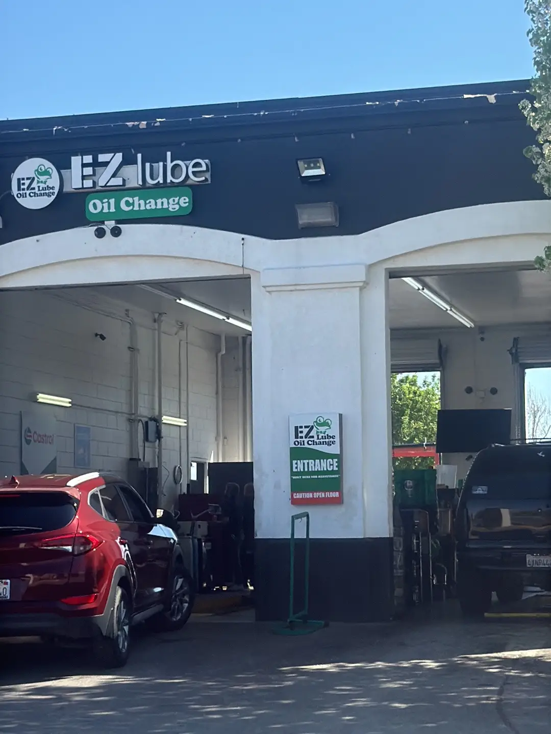 EZ Lube technician performing Castrol oil service in Lancaster